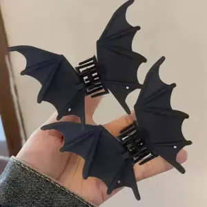 Bat Wing Hair Clip in hand