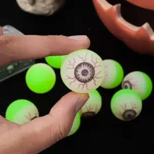 Glow in the Dark Eyeball Bouncy Balls in hand