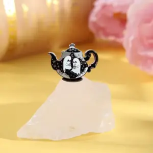 Haunted Teapot Enamel Pin – Cute Ghost Hard-Enamel Lapel Pin for Jackets, Bags & Collector on rock