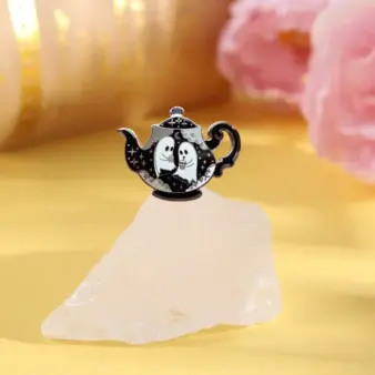 Haunted Teapot Enamel Pin – Cute Ghost Hard-Enamel Lapel Pin for Jackets, Bags & Collector on rock
