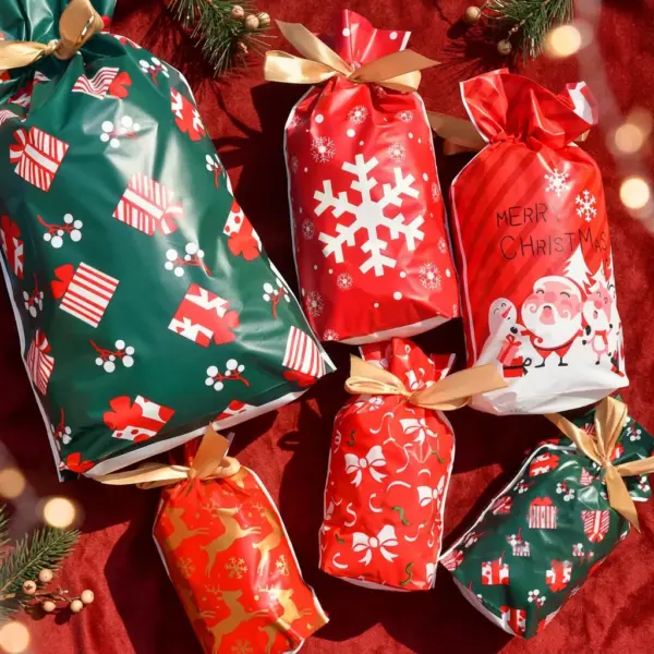 Santa Snowflake Drawstring Gift Bags for Treats & Holiday Favors lifestyle-flatlay